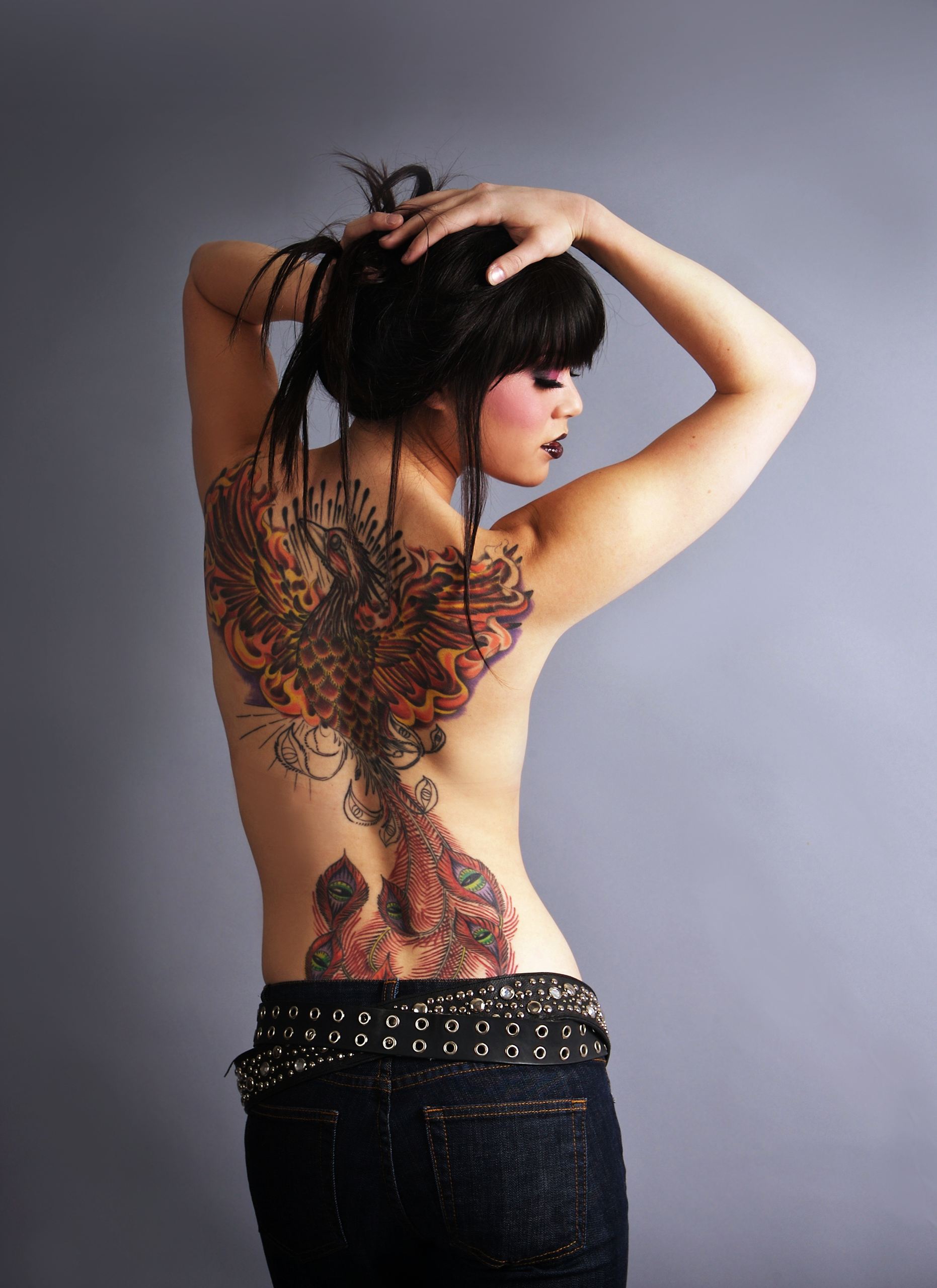 Beautiful woman with full back tattoo
